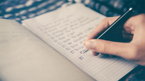 A person creating a checklist